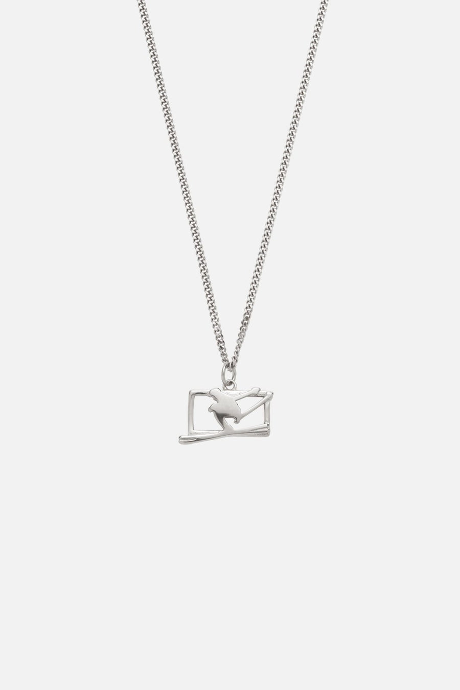 Silver-tone ski jumper pendant necklace, front view on a light background