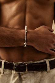 Silver-tone rigid bangle with screw-head ends, view 6 of 7