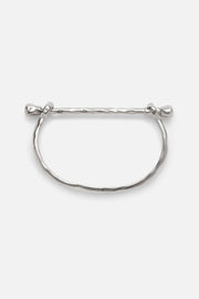 Silver-tone rigid bangle with screw-head ends, front view on a light background