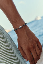 Brown cord bracelet with a white bead, view 4 of 6