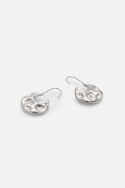 Pair of hammered disc earrings in silver tone