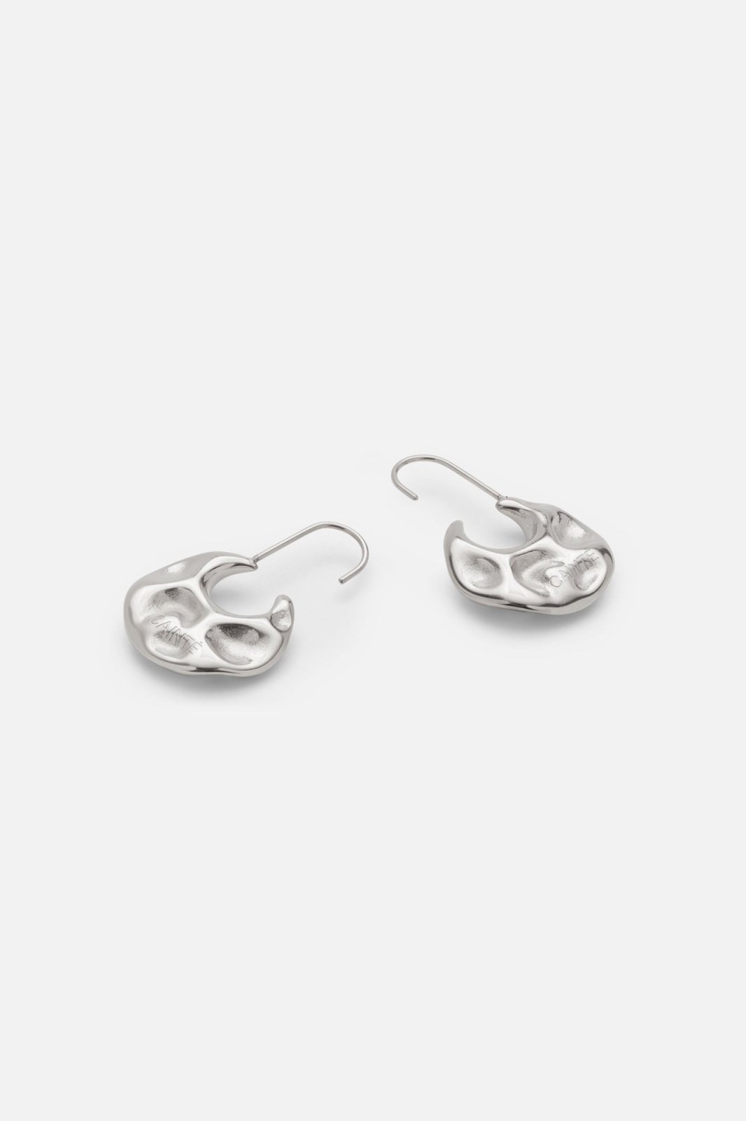 Pair of hammered disc earrings in silver tone