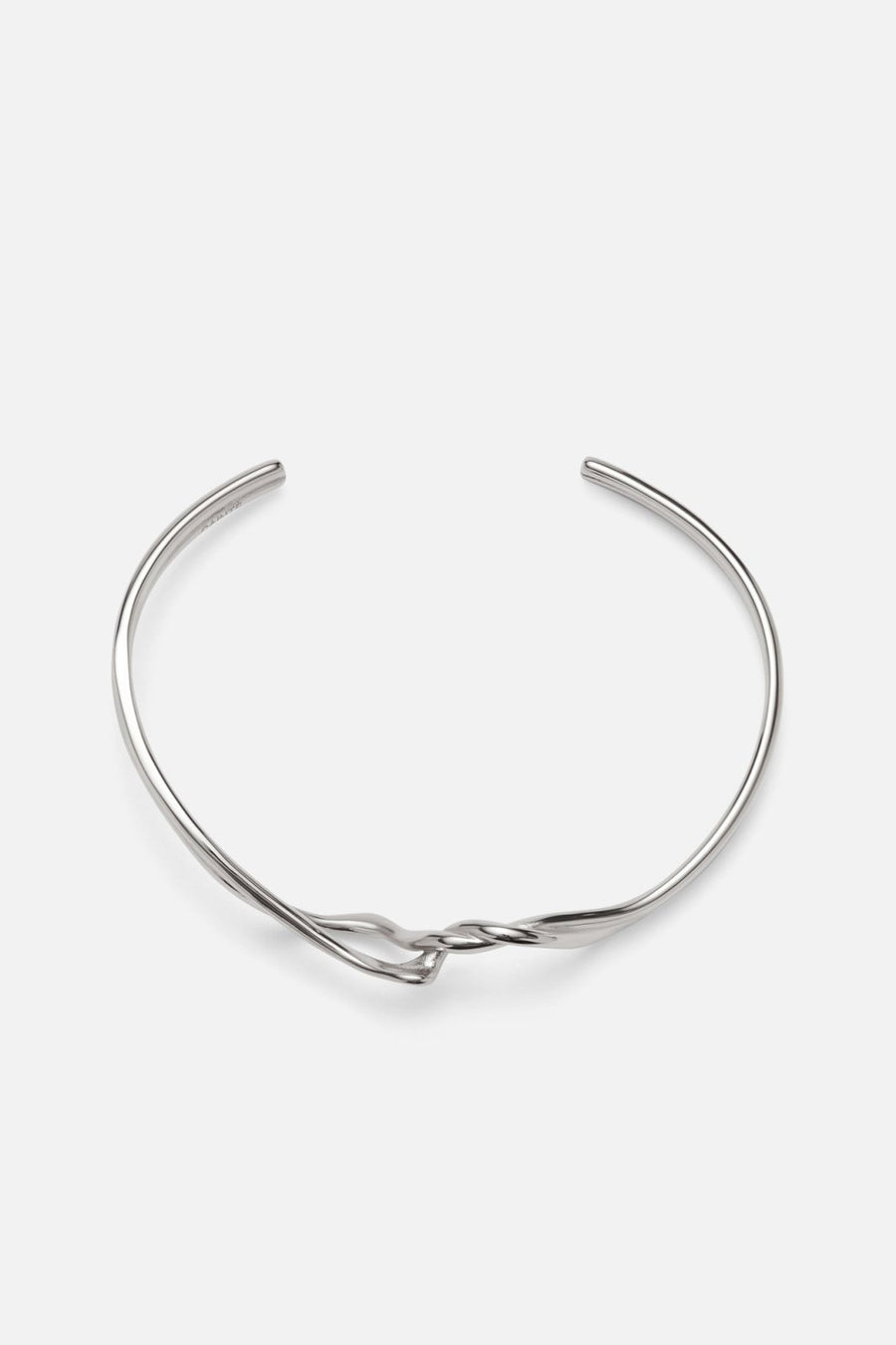 Silver-tone crossover twisted cuff, front view on a light background