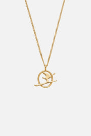 Gold-tone skier pendant necklace, front view on a light background
