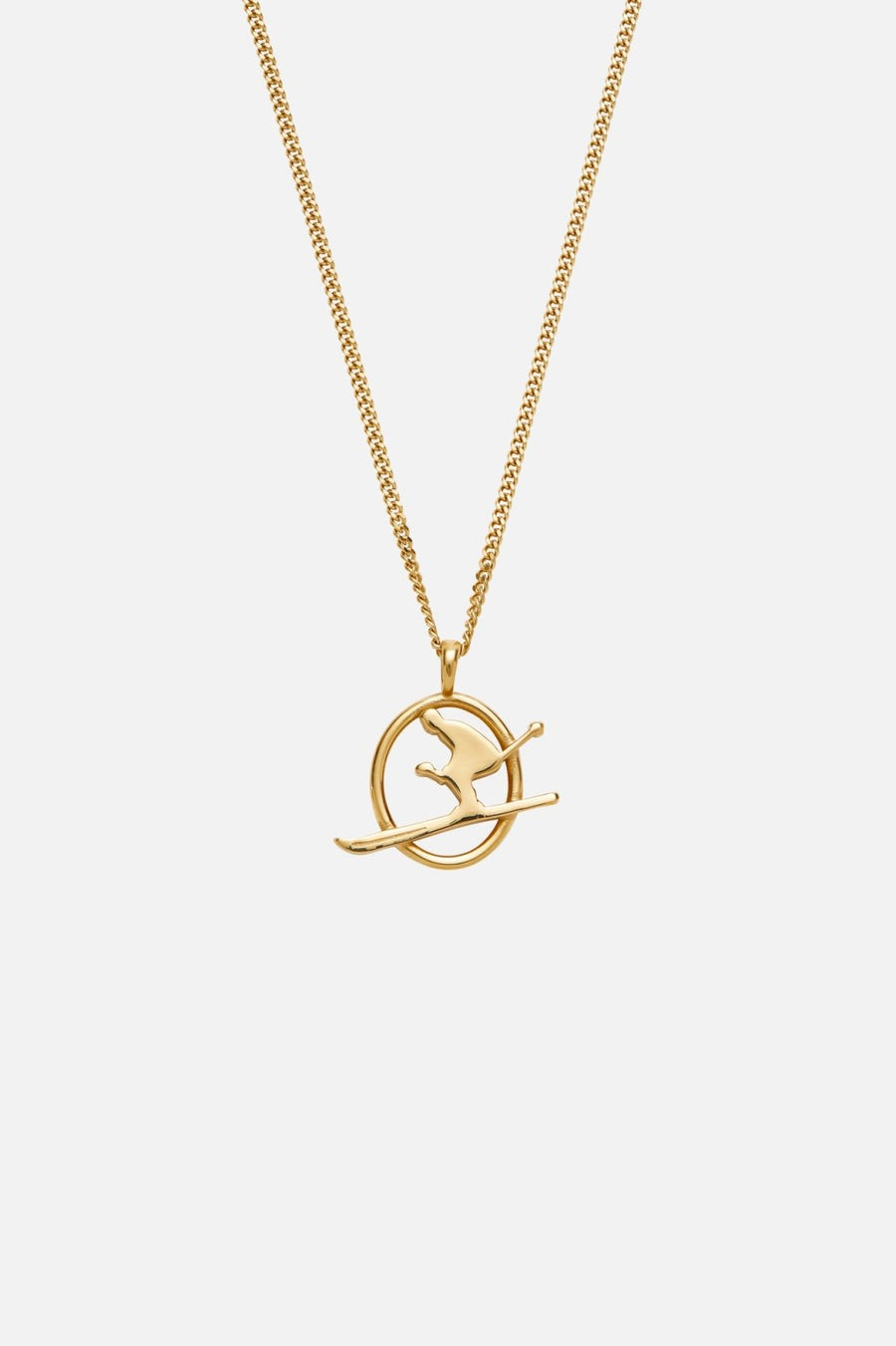 Gold-tone skier pendant necklace, front view on a light background