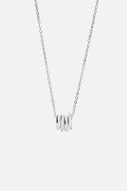 Silver-tone necklace with a cluster of small rings, front view on a light background