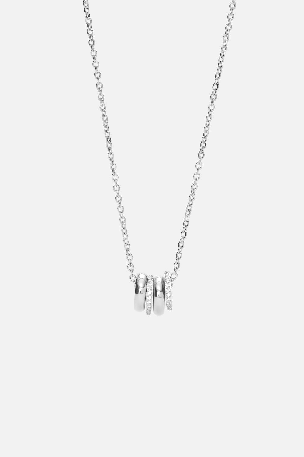 Silver-tone necklace with a cluster of small rings, front view on a light background
