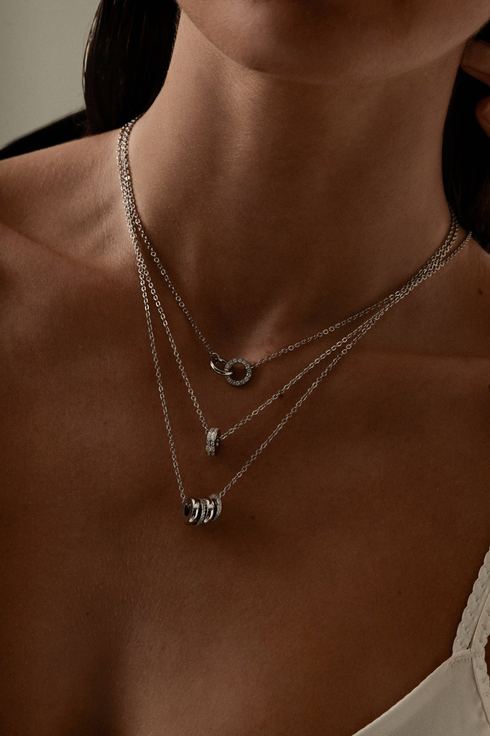 Silver-tone necklace with a cluster of small rings, view 6 of 8