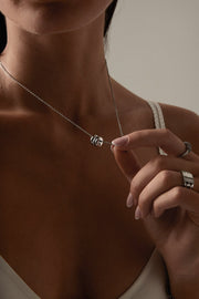 Silver-tone necklace with a cluster of small rings, view 5 of 8
