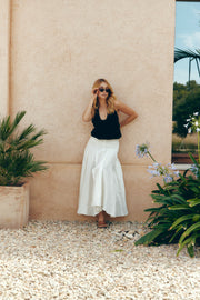 Woman in a garden wearing the cat eye sunglasses