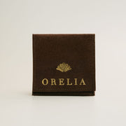 Brown jewelry pouch with a printed logo