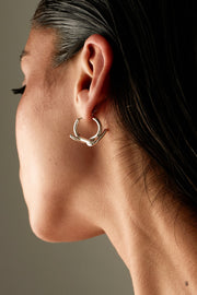 Close-up of the wave hoop worn on the ear