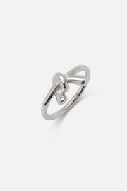 Silver-tone knot ring at an angle