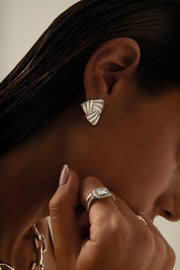 Close-up of the triangle stud on the ear