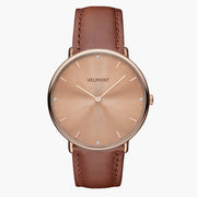 Watch with a rose gold-tone sunburst dial and rose gold-tone case on a brown strap, shown from the front.