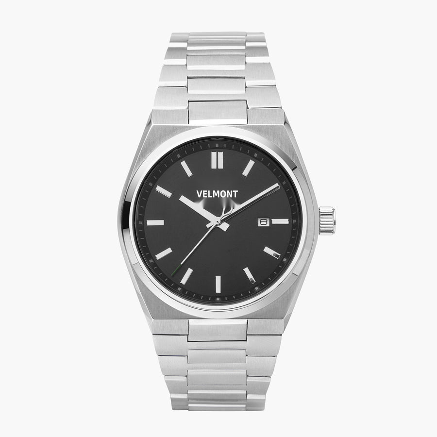 Watch with a black dial and silver-tone integrated link bracelet, shown from the front.