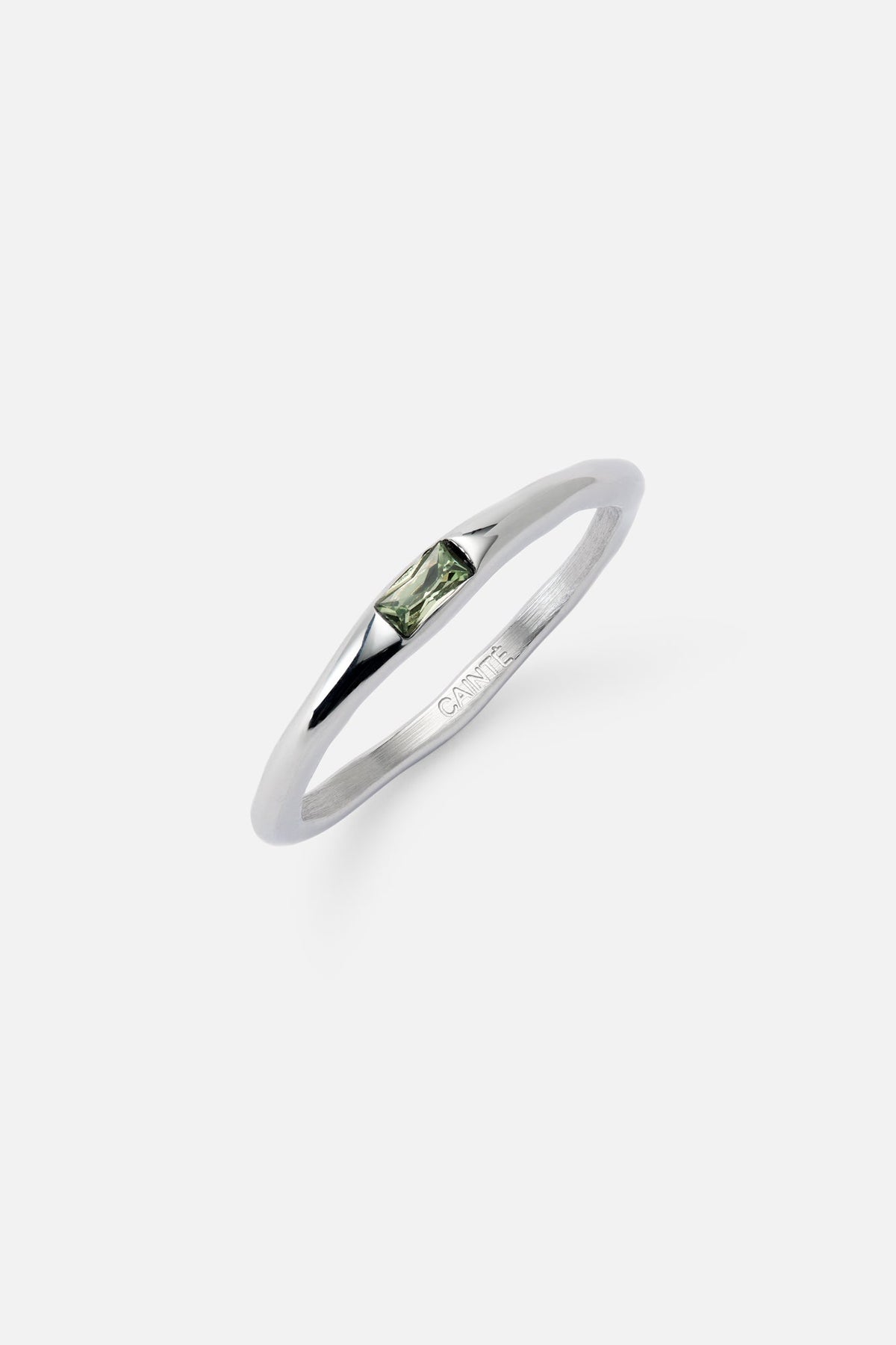Thin ring at an angle showing the rectangular green stone
