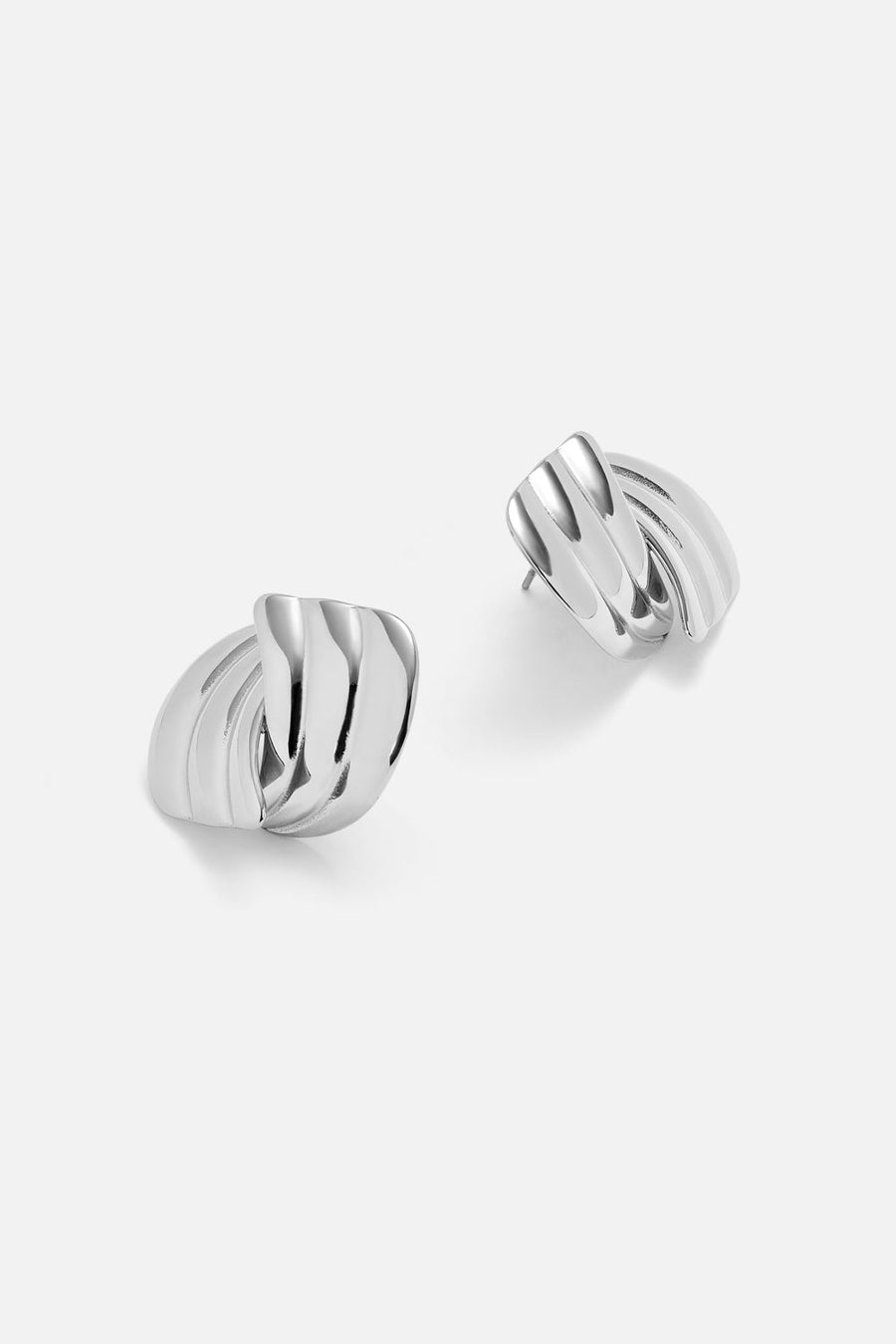 Pair of chunky layered stud earrings in silver tone