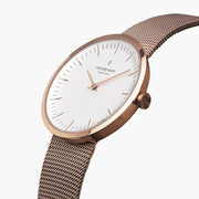 Angled view of the slim case, crown and white dial on mesh.