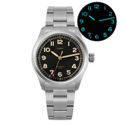 Black-dial field watch on a steel link bracelet with glow inset